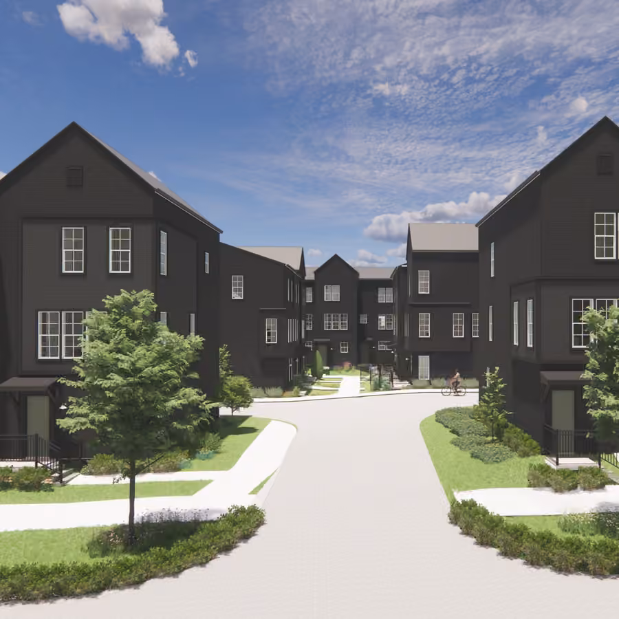 New two-story townhomes with front porches and landscaped yards