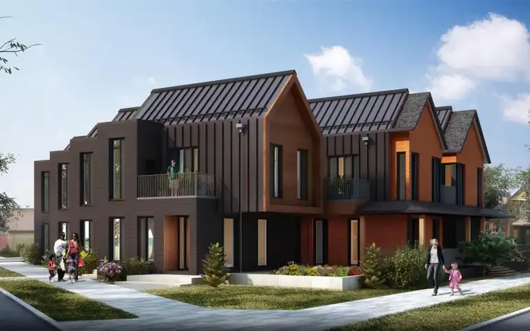 Concept rendering of a row of two- and three-story townhomes with metal roofs, wood and dark brick cladding, and a landscaped corner